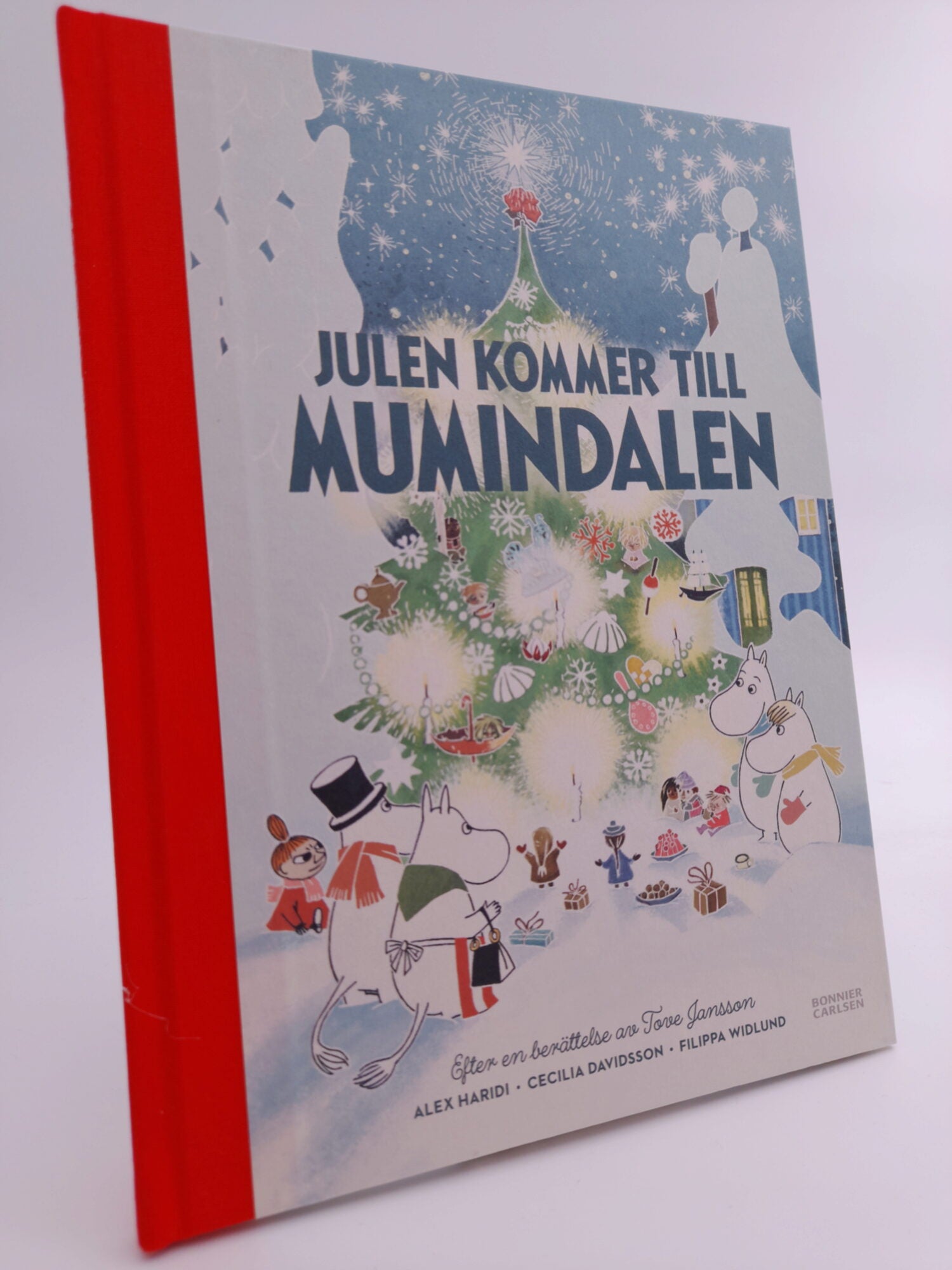 Haridi, Alex | Julen kommer till Mumindalen : Efter en berättelse av Tove Jansson